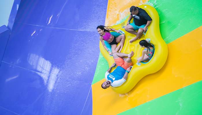 Family riding a tube on Stringray Ride in the Indoor Waterpark