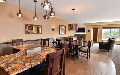 an overview of inside the Royal Hospitality Suite. Consists of kitchen area and fancy dining area.